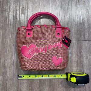 Pink tweed playboy bag.